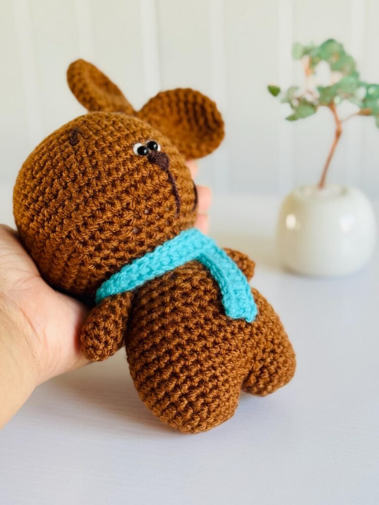 Close-up detail of handmade crochet amigurumi